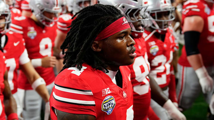 Ohio State Buckeyes wide receiver Jeremiah Smith (4) leaves the field following warm-ups prior to the Cotton Bowl at AT&T Stadium in Arlington, Texas for the College Football Playoff quarterfinal game against the Miami Hurricanes on Dec. 31, 2025.