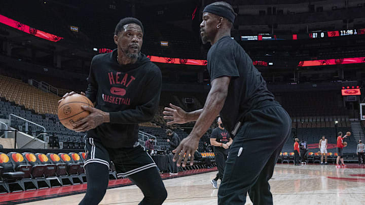 Feb 1, 2022; Toronto, Ontario, CAN; Miami Heat forward Udonis Haslem (40) controls the ball as forward Jimmy Butler (22) tries to defend during the warms up against the Toronto Raptors at Scotiabank Arena. Mandatory Credit: Nick Turchiaro-Imagn Images
