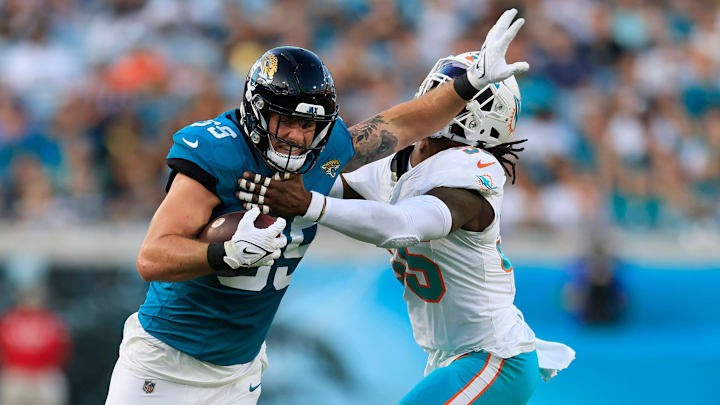 Jacksonville Jaguars tight end Luke Farrell (89) stiff arms Miami Dolphins linebacker Jerome Baker (55) during the first quarter of a preseason matchup Saturday, Aug. 26, 2023 at EverBank Stadium in Jacksonville, Fla. The game was suspended in the fourth after Miami Dolphins wide receiver Daewood Davis (87) was injured on a play with the Jaguars leading 31-18.