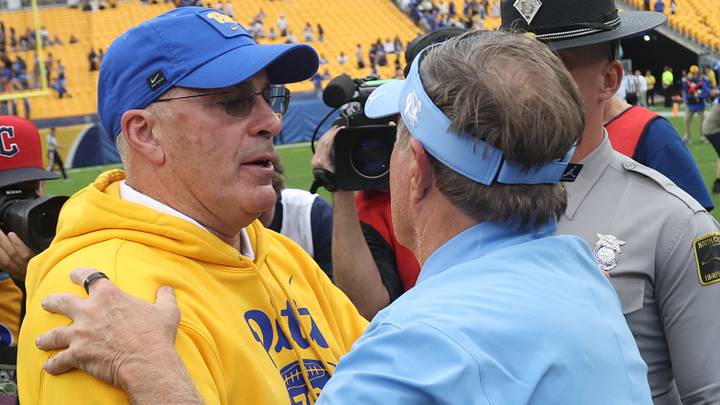 Oct 10, 2026; Pittsburgh, Pennsylvania, USA; Pittsburgh Panthers head coach Pat Narduzzi (left) and North Carolina Tar Heels head coach Bill Belichick (right) embrace after the game at Acrisure Stadium. Mandatory Credit: Charles LeClaire-Imagn Images Oct 10, 2026; Pittsburgh, Pennsylvania, USA; Pittsburgh Panthers head coach Pat Narduzzi (left) and North Carolina Tar Heels head coach Bill Belichick (right) embrace after the game at Acrisure Stadium. Mandatory Credit: Charles LeClaire-Imagn Images