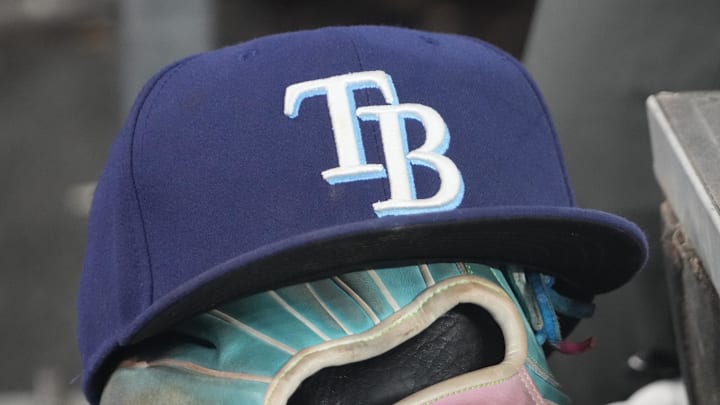 Sep 26, 2025; Toronto, Ontario, CAN; The hat and glove of Tampa Bay Rays third baseman Junior Caminero (13) in the dugout during the game against the Toronto Blue Jays at Rogers Centre. 