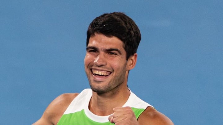 Carlos Alcaraz celebrates his victory over Novak Djokovic