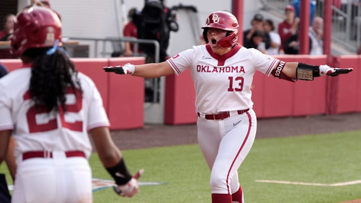 Isabela Emerling airplanes home after launching a grand slam in Oklahoma's victory over Arkansas on Friday at Love's Field.