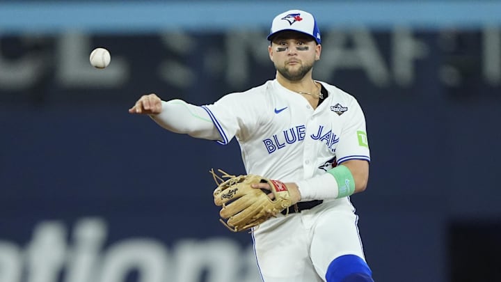 Nov 1, 2025; Toronto, Ontario, CAN; Toronto Blue Jays designated hitter Bo Bichette (11) throws to first for an out against Los Angeles Dodgers right fielder Teoscar Hernandez (37) in the eighth inning during game seven of the 2025 MLB World Series at Rogers Centre. Mandatory Credit: John E. Sokolowski-Imagn Images Nov 1, 2025; Toronto, Ontario, CAN; Toronto Blue Jays designated hitter Bo Bichette (11) throws to first for an out against Los Angeles Dodgers right fielder Teoscar Hernandez (37) in the eighth inning during game seven of the 2025 MLB World Series at Rogers Centre. Mandatory Credit: John E. Sokolowski-Imagn Images