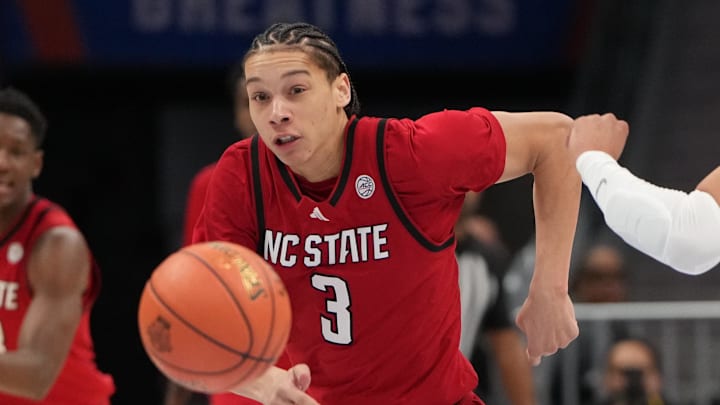 Mar 12, 2026; Charlotte, NC, USA; NC State Wolfpack guard Matt Able (3) and Virginia Cavaliers forward Devin Tillis (11) fight for the ball in the first half at Spectrum Center. Mandatory Credit: Bob Donnan-Imagn Images