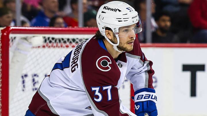 Apr 14, 2026; Calgary, Alberta, CAN; Colorado Avalanche defenseman Nick Blankenburg (37) controls the puck against the Calgary Flames during the second period at Scotiabank Saddledome. Mandatory Credit: Sergei Belski-Imagn Images