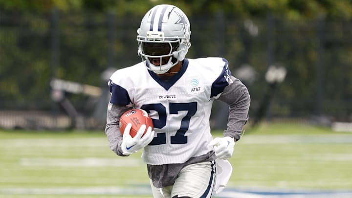 Jun 10, 2025; Arlington, TX, USA;  Dallas Cowboys running back Miles Sanders (27) goes through a drill during practice at the Ford Center at the Star Training Facility in Frisco, Texas. Mandatory Credit: Chris Jones-Imagn Images