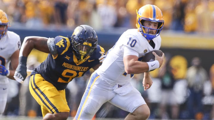 Sep 13, 2025; Morgantown, West Virginia, USA; Pittsburgh Panthers quarterback Eli Holstein (10) runs the ball during the first quarter against the West Virginia Mountaineers at Milan Puskar Stadium. Mandatory Credit: Ben Queen-Imagn Images