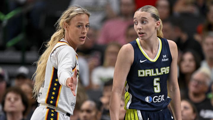 Aug 1, 2025; Dallas, Texas, USA; Dallas Wings guard Paige Bueckers (5) and Indiana Fever guard Sophie Cunningham (8) in action during the game between the Dallas Wings and the Indiana Fever at the American Airlines Center. Mandatory Credit: Jerome Miron-Imagn Images