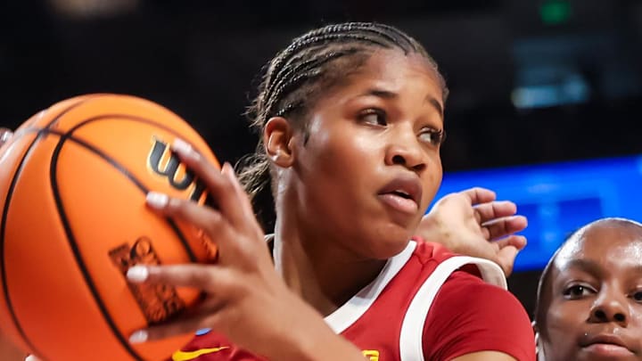 Mar 21, 2026; Columbia, South Carolina, USA; USC Trojans guard Kara Dunn (25) grabs a rebound in front of Clemson Tigers forward Raven Thompson (32) in the first half at Colonial Life Arena. Mandatory Credit: Jeff Blake-Imagn Images