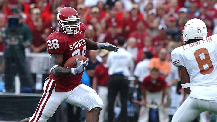 Oklahoma Sooners running back Adrian Peterson #28 runs as Texas Longhorn Cedric Griffin #8 prepares to make the tackle during first half action at the Cotton Bowl in Dallas Texas. Oklahoma Sooners running back Adrian Peterson #28 runs as Texas Longhorn Cedric Griffin #8 prepares to make the tackle during first half action at the Cotton Bowl in Dallas Texas.