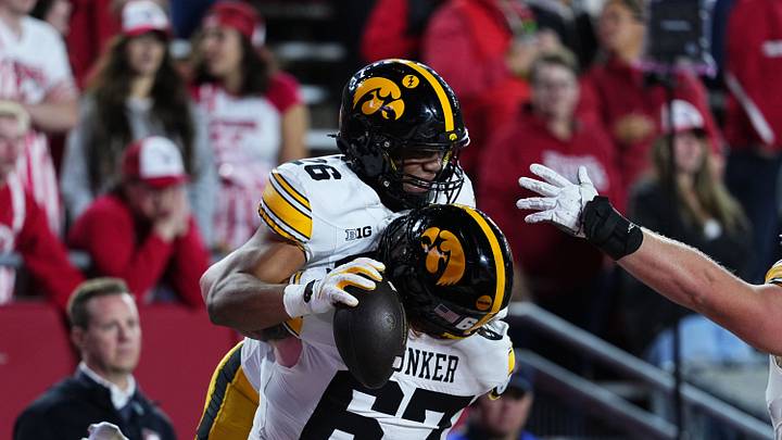 Oct 11, 2025; Madison, Wisconsin, USA; Iowa Hawkeyes running back Xavier Williams (26) celebrates a touchdown with teammate offensive lineman Gennings Dunker (67) during the second half against the Wisconsin Badgers at Camp Randall Stadium. Mandatory Credit: Ross Harried-Imagn Images Oct 11, 2025; Madison, Wisconsin, USA; Iowa Hawkeyes running back Xavier Williams (26) celebrates a touchdown with teammate offensive lineman Gennings Dunker (67) during the second half against the Wisconsin Badgers at Camp Randall Stadium. Mandatory Credit: Ross Harried-Imagn Images