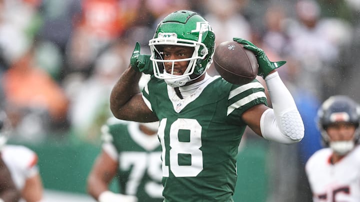 Sep 29, 2024; East Rutherford, New Jersey, USA; New York Jets wide receiver Mike Williams (18) celebrates a first down reception during the second half against the Denver Broncos at MetLife Stadium. Mandatory Credit: Vincent Carchietta-Imagn Images
