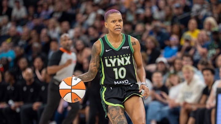 Jul 5, 2025; Minneapolis, Minnesota, USA; Minnesota Lynx guard Courtney Williams (10) assesses the defense as Golden State Valkyries guard Tiffany Hayes (15) closes the gap in the fourth quarter at Target Center. Mandatory Credit: Matt Blewett-Imagn Images