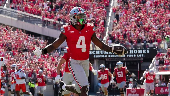 Ohio State Buckeyes wide receiver Jeremiah Smith (4) scores a touchdown during the NCAA football game against the Illinois Fighting Illini at Ohio Stadium in Columbus on Sept. 26, 2026.