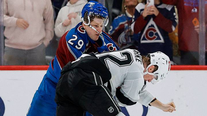 Sep 30, 2026; Denver, Colorado, USA; Colorado Avalanche center Nathan MacKinnon (29) and Los Angeles Kings defenseman Brandt Clarke (92) fight in the third period at Ball Arena. Mandatory Credit: Isaiah J. Downing-Imagn Images