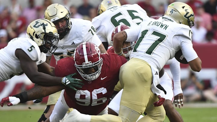 Sep 7, 2024; Tuscaloosa, Alabama, USA;  Alabama Crimson Tide defensive lineman Tim Keenan III (96) tackles South Florida Bulls quarterback Byrum Brown (17) during the first half at Bryant-Denny Stadium. 