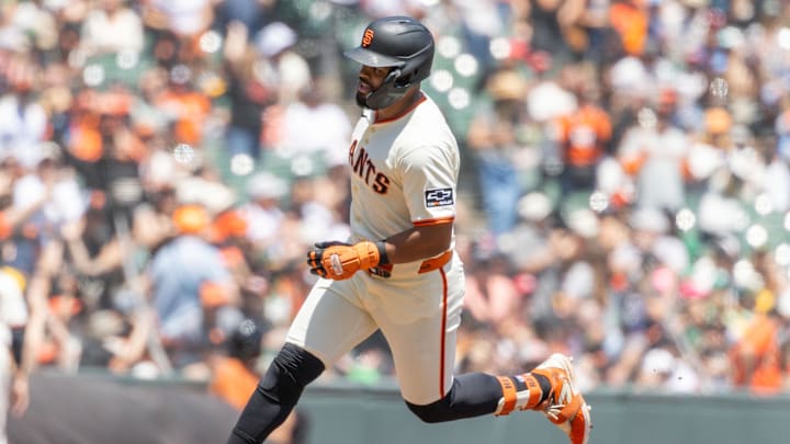 May 18, 2025; San Francisco, California, USA; San Francisco Giants first base LaMonte Wade Jr. (31) heads home to score a run during the eighth inning against the Athletics at Oracle Park. May 18, 2025; San Francisco, California, USA; San Francisco Giants first base LaMonte Wade Jr. (31) heads home to score a run during the eighth inning against the Athletics at Oracle Park.