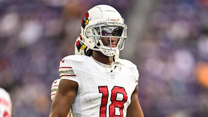 Dec 1, 2024; Minneapolis, Minnesota, USA; Arizona Cardinals wide receiver Marvin Harrison Jr. (18) looks on before the game against the Minnesota Vikings at U.S. Bank Stadium. Mandatory Credit: Jeffrey Becker-Imagn Images