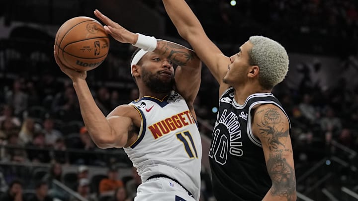 Nov 7, 2022; San Antonio, Texas, USA;  Denver Nuggets forward Bruce Brown (11) looks to pass against San Antonio Spurs forward Jeremy Sochan (10) in the second half at the AT&T Center.