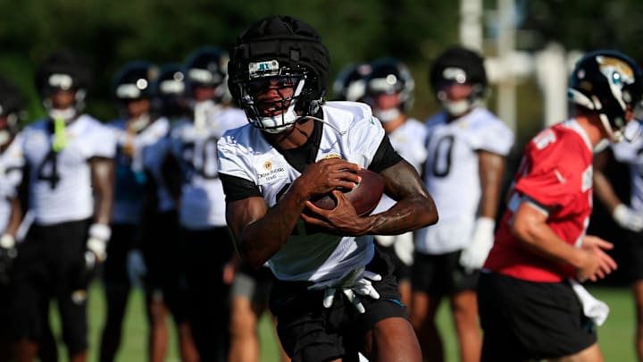 Jacksonville Jaguars wide receiver Travis Hunter (12) runs the ball during an NFL training camp session at the Miller Electric Center, Monday, Aug. 11, 2025 in Jacksonville, Fla. [Corey Perrine/Florida Times-Union]