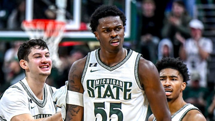 Michigan State's Coen Carr, center, celebrates with, from left, Jase Richardson, Frankie Fidler and Jaden Akins after Carr's 3-pointer against Florida Atlantic during the second half on Saturday, Dec. 21, 2024, in East Lansing.