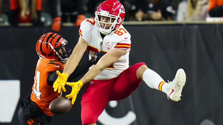 Kansas City Chiefs tight end Travis Kelce (87) is unable to catch a deep pass under pressure from Cincinnati Bengals safety Vonn Bell (24) in the second quarter at Paycor Stadium on Dec. 4, 2022.