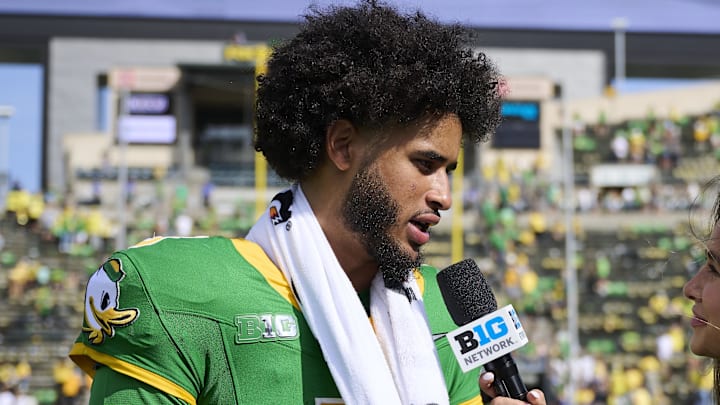 Aug 30, 2025; Eugene, Oregon, USA; Oregon Ducks quarterback Dante Moore (5) talks to the media after a game against the Montana State Bobcats at Autzen Stadium. Mandatory Credit: Troy Wayrynen-Imagn Images