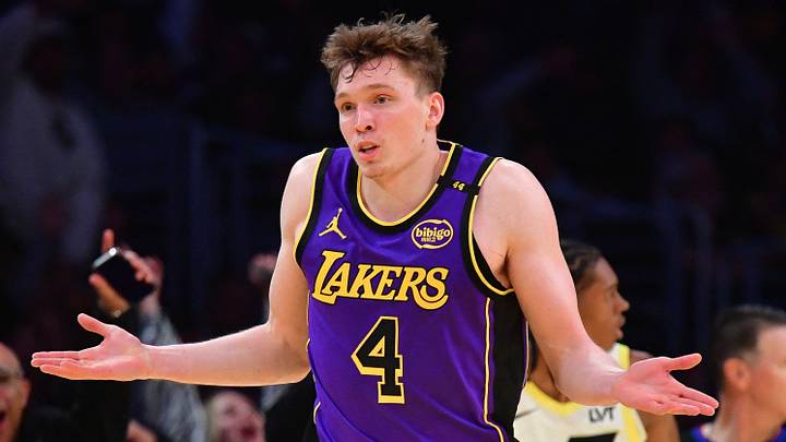 Nov 19, 2024; Los Angeles, California, USA; Los Angeles Lakers guard Dalton Knecht (4) react after scoring a three point basket against the Utah Jazz during the second half at Crypto.com Arena. Mandatory Credit: Gary A. Vasquez-Imagn Images