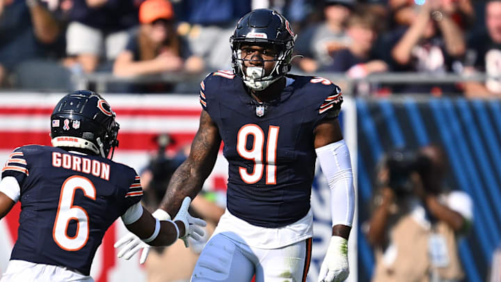 Sep 10, 2023; Chicago, Illinois, USA;  Chicago Bears defensive lineman Yannick Ngakoue (91) celebrates with defensive back Kyler Gordon (6) after dropping the Green Bay Packers ballcarrier for a loss in the first half at Soldier Field. Mandatory Credit: Jamie Sabau-Imagn Images