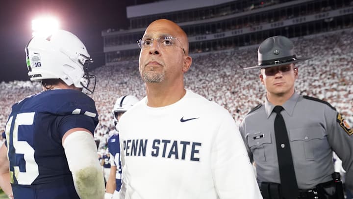 Sep 27, 2025; University Park, Pennsylvania, USA; Penn State Nittany Lions head coach James Franklin and quarterback Drew Allar (15) react after losing to the Oregon Ducks at Beaver Stadium. Mandatory Credit: James Lang-Imagn Images
