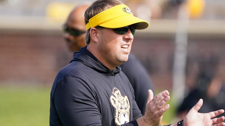 Oct 22, 2022; Columbia, Missouri, USA; Missouri Tigers head coach Eli Drinkwitz watches warm ups against the Vanderbilt Commodores prior to the game at Faurot Field at Memorial Stadium. Mandatory Credit: Denny Medley-Imagn Images Oct 22, 2022; Columbia, Missouri, USA; Missouri Tigers head coach Eli Drinkwitz watches warm ups against the Vanderbilt Commodores prior to the game at Faurot Field at Memorial Stadium. Mandatory Credit: Denny Medley-Imagn Images