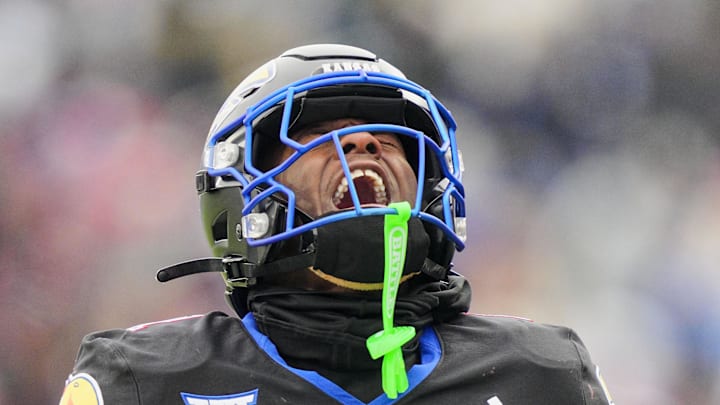 Kansas Jayhawks wide receiver Emmanuel Henderson Jr. celebrates