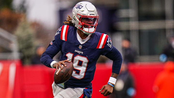 Jan 5, 2025; Foxborough, Massachusetts, USA; New England Patriots quarterback Joe Milton III (19) runs the ball against the Buffalo Bills in the first half at Gillette Stadium. Mandatory Credit: David Butler II-Imagn Images