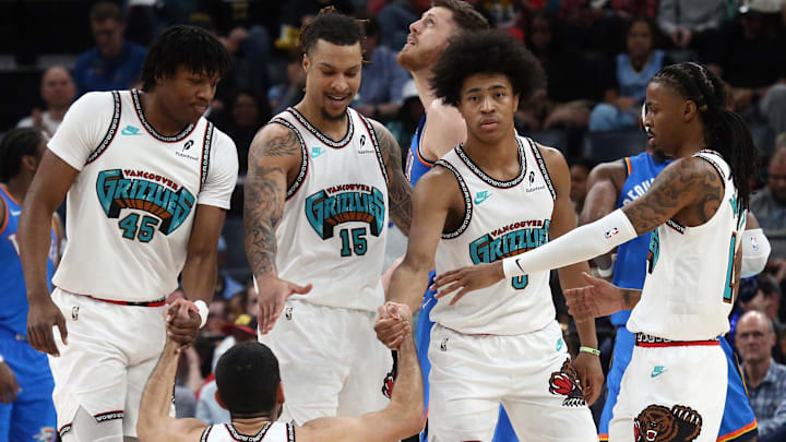 Feb 8, 2025; Memphis, Tennessee, USA; Memphis Grizzlies forward GG Jackson II (45), forward Brandon Clarke (15), forward Jaylen Wells (0) and guard Ja Morant (12) help forward Santi Aldama (7) during the second quarter against the Oklahoma City Thunder at FedExForum. Mandatory Credit: Petre Thomas-Imagn Images
