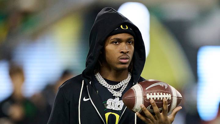 Nov 14, 2025; Eugene, Oregon, USA; Oregon Ducks wide receiver Dakorien Moore (1) watches teammates warm up before a game against the Minnesota Golden Gophers at Autzen Stadium. Nov 14, 2025; Eugene, Oregon, USA; Oregon Ducks wide receiver Dakorien Moore (1) watches teammates warm up before a game against the Minnesota Golden Gophers at Autzen Stadium.