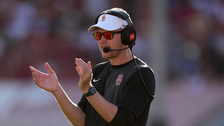 Aug 30, 2025; Los Angeles, California, USA; Southern California Trojans head coach Lincoln Riley watches from the sidelines against the Missouri State Bears in the first half at United Airlines Field at Los Angeles Memorial Coliseum. Mandatory Credit: Kirby Lee-Imagn Images