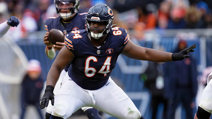 Dec 10, 2023; Chicago, Illinois, USA;  Chicago Bears offensive lineman Nate Davis (64) blocks against the Detroit Lions at Soldier Field. Mandatory Credit: Jamie Sabau-Imagn Images