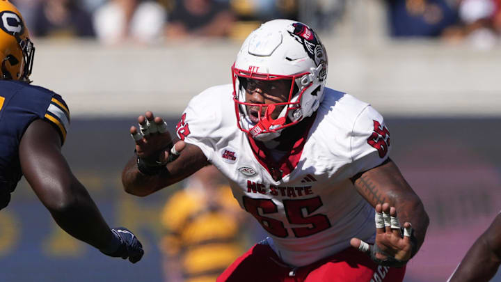 Oct 19, 2024; Berkeley, California, USA; North Carolina State Wolfpack offensive tackle Jacarrius Peak (65) blocks against California Golden Bears linebacker Cheikhsaliou Fall (17) during the second quarter at California Memorial Stadium. Mandatory Credit: Darren Yamashita-Imagn Images Oct 19, 2024; Berkeley, California, USA; North Carolina State Wolfpack offensive tackle Jacarrius Peak (65) blocks against California Golden Bears linebacker Cheikhsaliou Fall (17) during the second quarter at California Memorial Stadium. Mandatory Credit: Darren Yamashita-Imagn Images