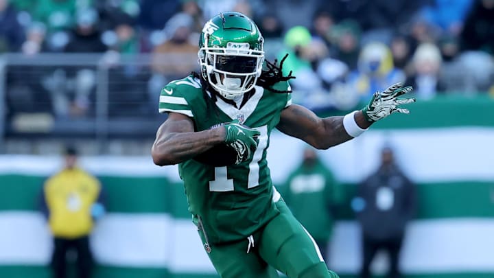 Dec 22, 2024; East Rutherford, New Jersey, USA; New York Jets wide receiver Davante Adams (17) runs with the ball against the Los Angeles Rams during the second quarter at MetLife Stadium. Mandatory Credit: Brad Penner-Imagn Images