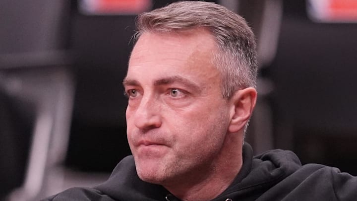 Toronto Raptors head coach Darko Rajakovic watches warm up before a game against the Charlotte Hornets Toronto Raptors head coach Darko Rajakovic watches warm up before a game against the Charlotte Hornets