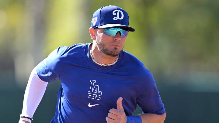 Miguel Rojas (11) participates in base running drills during spring training at Camelback Ranch on Feb. 19, 2024. 
