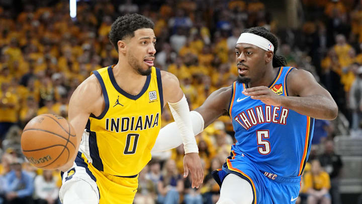 Jun 13, 2025; Indianapolis, Indiana, USA; Indiana Pacers guard Tyrese Haliburton (0) dribbles the ball against Oklahoma City Thunder guard Luguentz Dort (5) during the second half during game four of the 2025 NBA Finals at Gainbridge Fieldhouse. Mandatory Credit: Kyle Terada-Imagn Images Jun 13, 2025; Indianapolis, Indiana, USA; Indiana Pacers guard Tyrese Haliburton (0) dribbles the ball against Oklahoma City Thunder guard Luguentz Dort (5) during the second half during game four of the 2025 NBA Finals at Gainbridge Fieldhouse. Mandatory Credit: Kyle Terada-Imagn Images