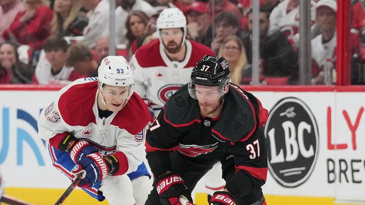 May 29, 2026; Raleigh, North Carolina, USA; Carolina Hurricanes right wing Andrei Svechnikov (37) plays the puck against Montreal Canadiens right wing Ivan Demidov (93) in game five of the Eastern Conference Final of the 2026 Stanley Cup Playoffs during the first period at Lenovo Center. Mandatory Credit: James Guillory-Imagn Images