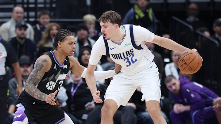 Dec 15, 2025; Salt Lake City, Utah, USA; Dallas Mavericks forward Cooper Flagg (32) controls the ball as Utah Jazz guard Keyonte George (3) defends during the second half at Delta Center. Mandatory Credit: Rob Gray-Imagn Images Dec 15, 2025; Salt Lake City, Utah, USA; Dallas Mavericks forward Cooper Flagg (32) controls the ball as Utah Jazz guard Keyonte George (3) defends during the second half at Delta Center. Mandatory Credit: Rob Gray-Imagn Images