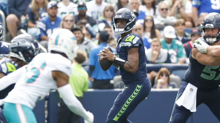 Sep 22, 2024; Seattle, Washington, USA; Seattle Seahawks quarterback Geno Smith (7) looks to pass against the Miami Dolphins during the second quarter at Lumen Field. 