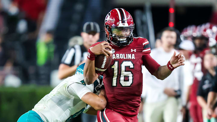 Nov 22, 2025; Columbia, South Carolina, USA; South Carolina Gamecocks quarterback Lanorris Sellers (16) is knocked out of bounds by Coastal Carolina Chanticleers cornerback Myles Mooyoung (8) in the second half at Williams-Brice Stadium. Mandatory Credit: Jeff Blake-Imagn Images Nov 22, 2025; Columbia, South Carolina, USA; South Carolina Gamecocks quarterback Lanorris Sellers (16) is knocked out of bounds by Coastal Carolina Chanticleers cornerback Myles Mooyoung (8) in the second half at Williams-Brice Stadium. Mandatory Credit: Jeff Blake-Imagn Images