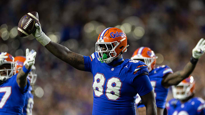 Nov 16, 2024; Gainesville, Florida, USA; Florida Gators defensive lineman Caleb Banks (88) celebrates with the ball after a fumble recovery against the LSU Tigers during the second half at Ben Hill Griffin Stadium. Mandatory Credit: Matt Pendleton-Imagn Images