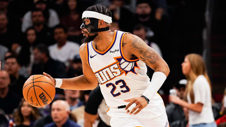 Feb 11, 2026; Phoenix, Arizona, USA;  Phoenix Suns guard Jordan Goodwin (23) dribbles during the first half of the game at Mortgage Matchup Center. Mandatory Credit: Arianna Grainey-Imagn Images