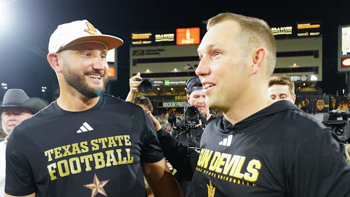 Sep 13, 2025; Tempe, Arizona, USA; Texas State Bobcats head coach G. J. Kinne and Arizona State Sun Devils head coach Kenny Dillingham meet after the game between Arizona State Sun Devils and Texas State Bobcats. Mandatory Credit: Arianna Grainey-Imagn Images